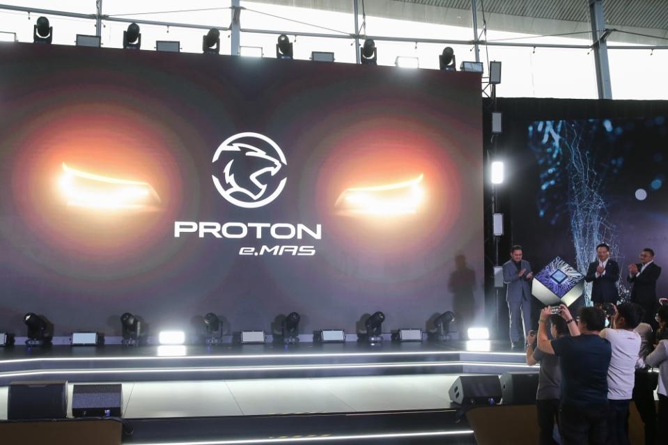 (From left to right) Proton Chairman Datuk Seri Syed Faisal Albar, Proton chief executive officer Dr Li Churning and Proton deputy chief executive officer Roslan Abdullah during the launch of the new Proton EV Brand and Logo at the Proton Centre of Excellence Centre in Subang Jaya today. — Picture by Yusof Mat Isa