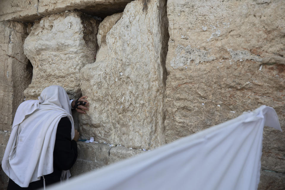 An ultra-Orthodox Jewish man prays ahead of the Jewish new year at the Western Wall, the holiest site where Jews can pray in Jerusalem's old city, Wednesday, Sept. 16, 2020. (AP Photo/Sebastian Scheiner)