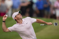 Rory McIlroy throws his ball to the crowd after winning on the 18th hole during the fourth round of the Wells Fargo Championship golf tournament at Quail Hollow on Sunday, May 9, 2021, in Charlotte, N.C. (AP Photo/Jacob Kupferman)