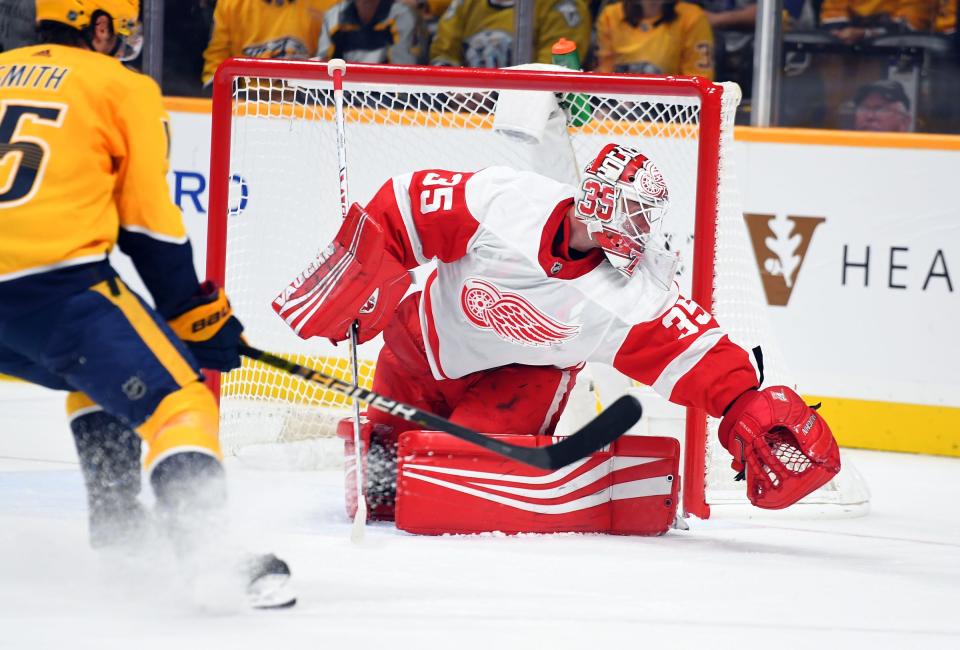 Detroit Red Wings goaltender Jimmy Howard plays the puck behind the net after a save during the first period against the Nashville Predators, Saturday, Oct. 5, 2019, in Nashville.