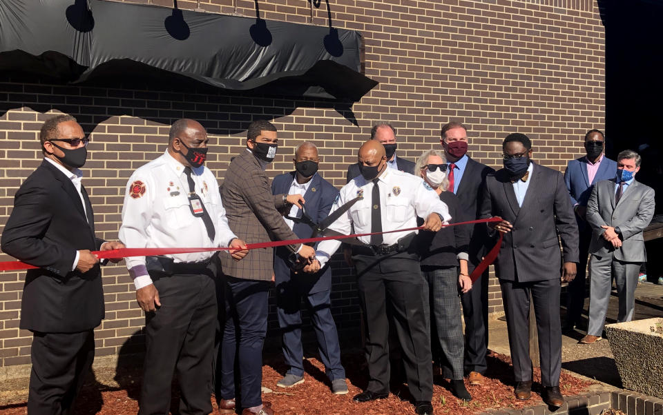 Image: Jackson Mayor Chokwe Lumumba, third from the left, joins dignitaries for a ribbon cutting unveiling the city's new real time command center on Nov. 19, 2020. (Bracey Harris / NBC News)