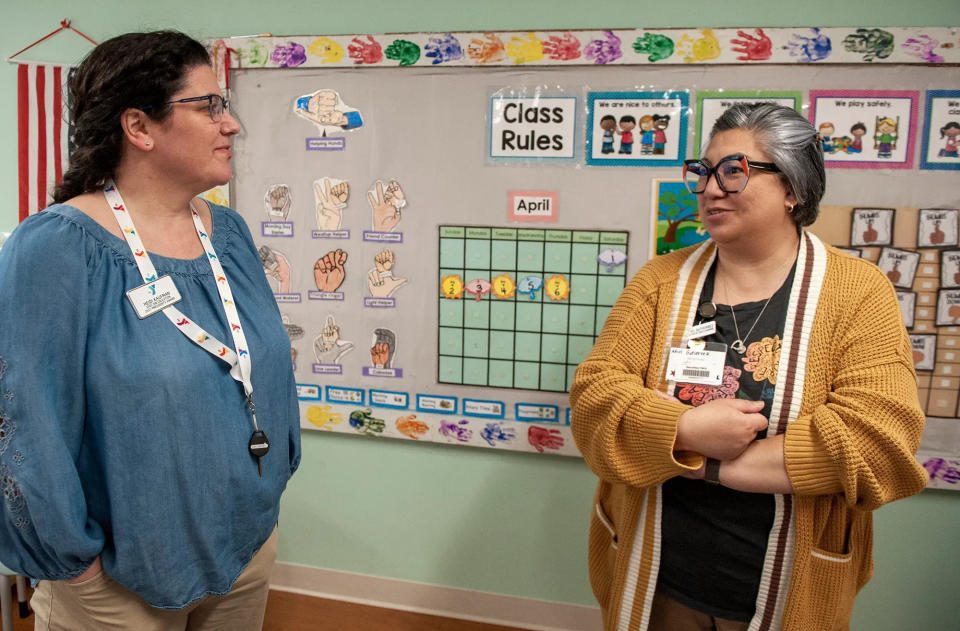 Heidi Kaufman, left, is executive director of education at the MetroWest YMCA in Framingham. Here she chats with Director of Early Learning Adiel Gutierrez.