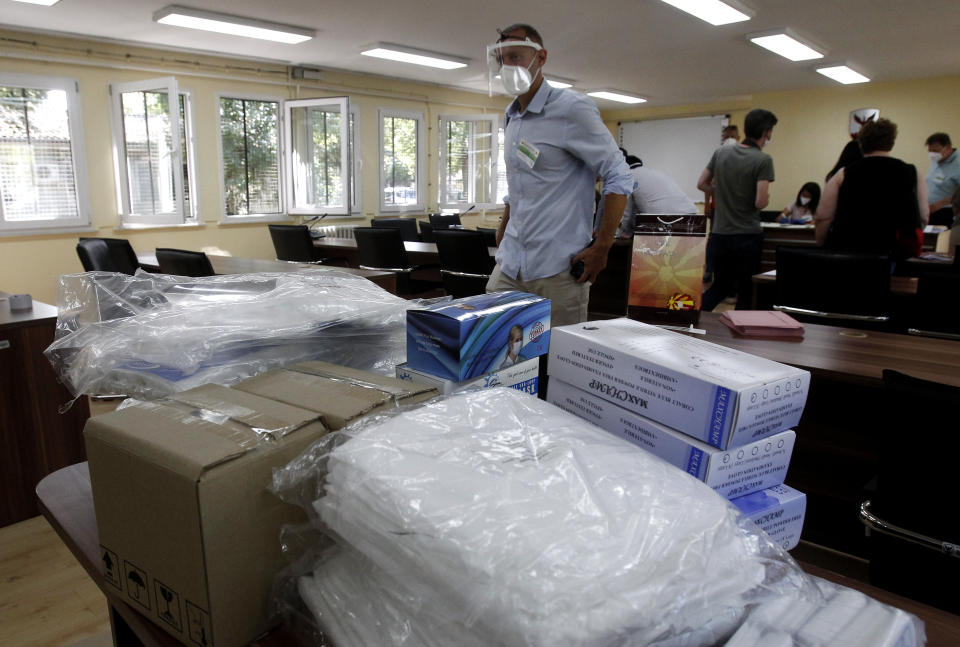 Protective medical equipment for special election teams visiting voters who have coronavirus, are stored at the municipal election commission headquarters in Skopje, North Macedonia, Monday, July 13, 2020. North Macedonia holds its first parliamentary election under its new country name this week, with voters heading to the polls during an alarming spike of coronavirus cases in the small Balkan nation. Opinion polls in the run-up to Wednesday’s vote indicate a close race between coalitions led by the Social Democrats and the center-right opposition VMRO-DPMNE party. (AP Photo/Boris Grdanoski)