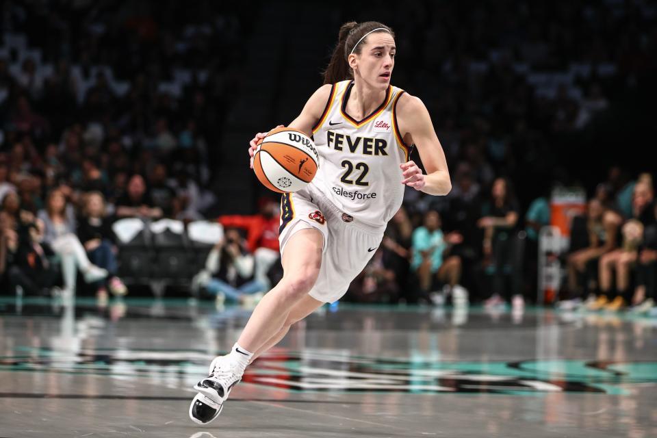 Indiana Fever guard Caitlin Clark (22) drives to the basket in the first quarter against the New York Liberty at Barclays Center.