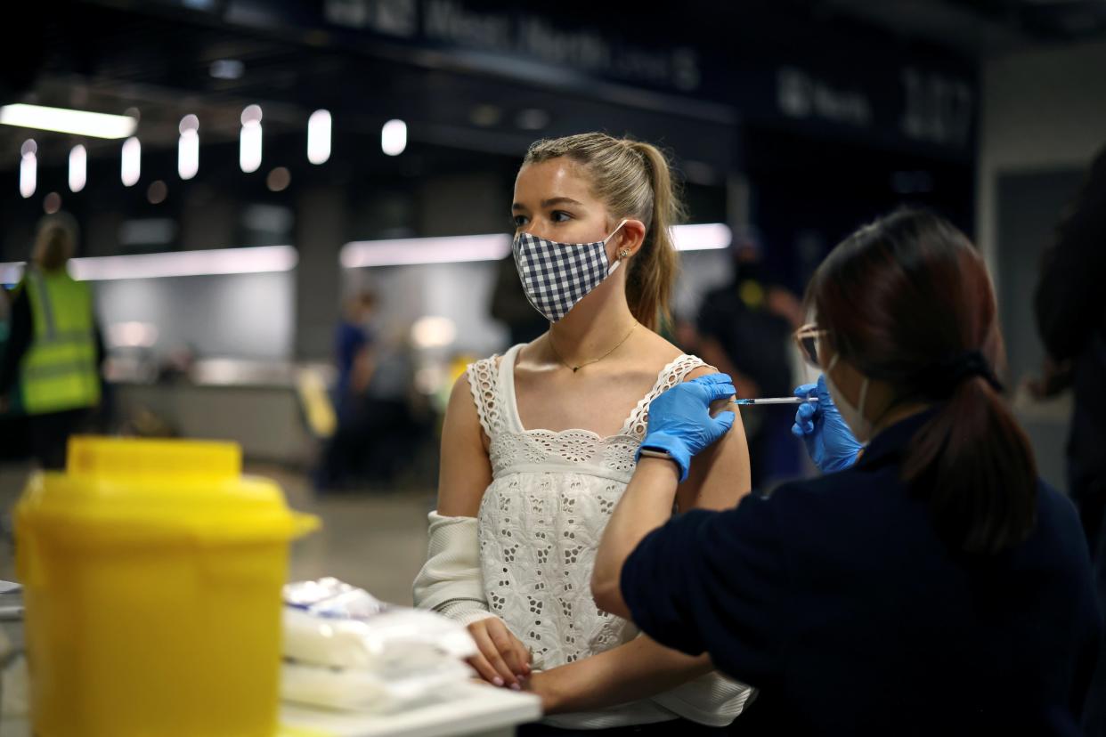 A person receives a Covid vaccine at a mass vaccination centre at Tottenham Hotspur Stadium (REUTERS)