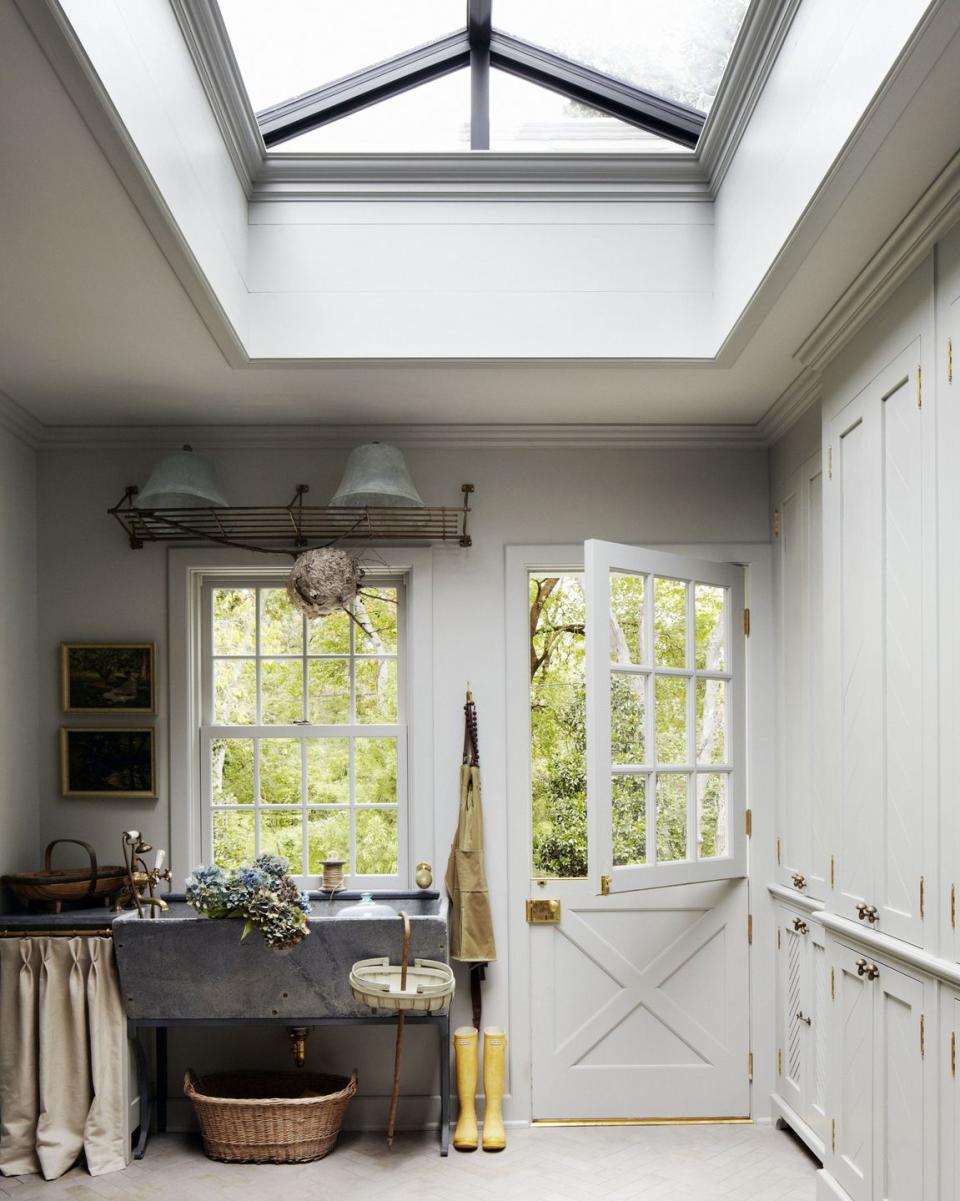 <p>Make the mudroom work harder, too. This house added a soapstone sink for washing the family's dogs, who go in and out through a louvered dog door at the base of the floor-to-ceiling cabinets.</p>