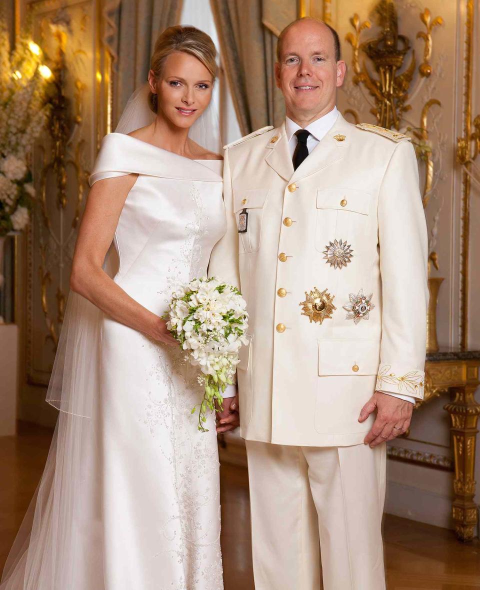 <p>Charlene's handmade gown for her religious wedding ceremony had been announced six months earlier by Giorgio Armani. Made from 425 feet of white silk, the robe featured a 66-foot veil and train, embroidered with 60,000 crystals and mother of pearl teardrops. Despite its intricacies, it showed off Charlene's athletic figure with classical simplicity and continues to draw compliments for its modernity.</p>