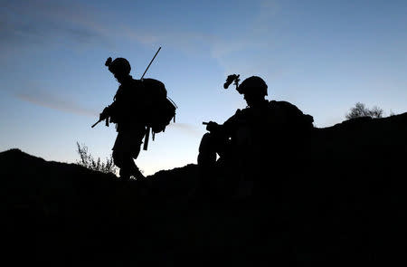 FILE PHOTO: U.S soldier patrols near town of Walli Was in Paktika province near border with Pakistan November 6, 2012. REUTERS/Goran Tomasevic/File Photo