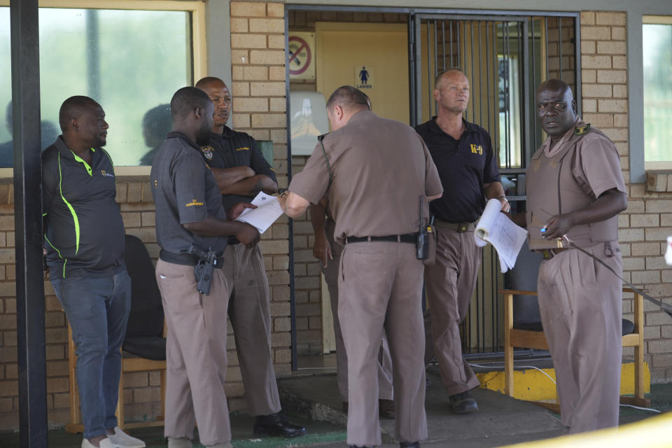 K-9 officers gather at the entrance of Atteridgeville Prison where Oscar Pistorius is being held, ahead of a parole hearing, in Pretoria, South Africa, Friday, Nov. 24, 2023. The double-amputee Olympic runner was convicted of a charge comparable to third-degree murder for shooting Reeva Steenkamp in his home in 2013. (AP Photo/ Tsvangirayi Mukwazhi)