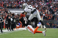 Cincinnati Bengals' Mike Hilton (21) breaks up a pass intended for Las Vegas Raiders' Hunter Renfrow (13) during the first half of an NFL wild-card playoff football game, Saturday, Jan. 15, 2022, in Cincinnati. (AP Photo/Jeff Dean)