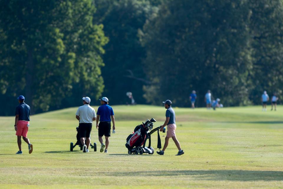 Participants walk the 10th fairway during the Evansville Men's City Golf Tournament qualifying round at Fendrich Golf Course in Evansville, Ind., Saturday morning, July 2, 2022. 