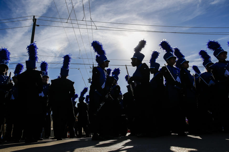 In this Monday, Jan. 15, 2018 photo, C.E. King High School band members wait to perform in the MLK Grande Parade in Houston. For more than two decades, competing MLK Day parades have been held in Houston. This year, the city of Houston threw its official support behind one parade, the 41st annual “Original” MLK, Jr. Parade, hoping the city could unite behind only one parade. But organizers of the other parade, the 25th annual MLK Grande Parade, will still be holding its event and they say they have no plans to stop having their own parade. (Michael Ciaglo/Houston Chronicle via AP)