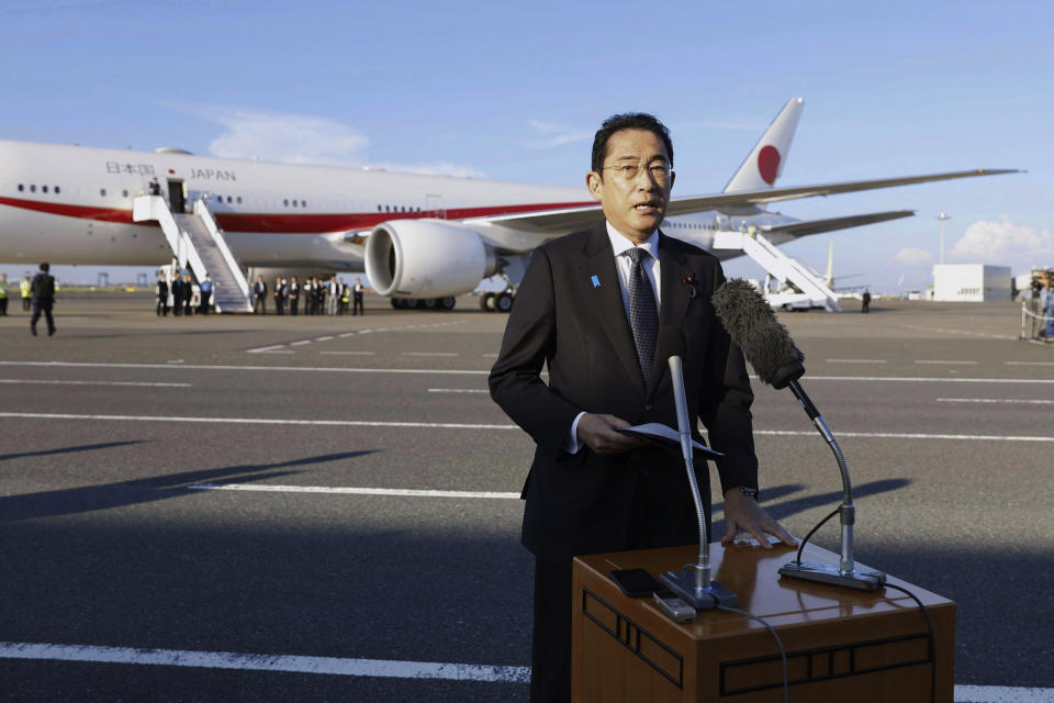 Japanese Prime Minister Fumio Kishida speaks before he gets on an airplane at the Haneda international airport in Tokyo, Thursday, Aug. 17, 2023, on his way to Camp David in Maryland of the United States to meet with U.S. President Joe Biden and South Korean President Yoon Suk Yeol. (Masanori Kumagai/Kyodo News via AP)