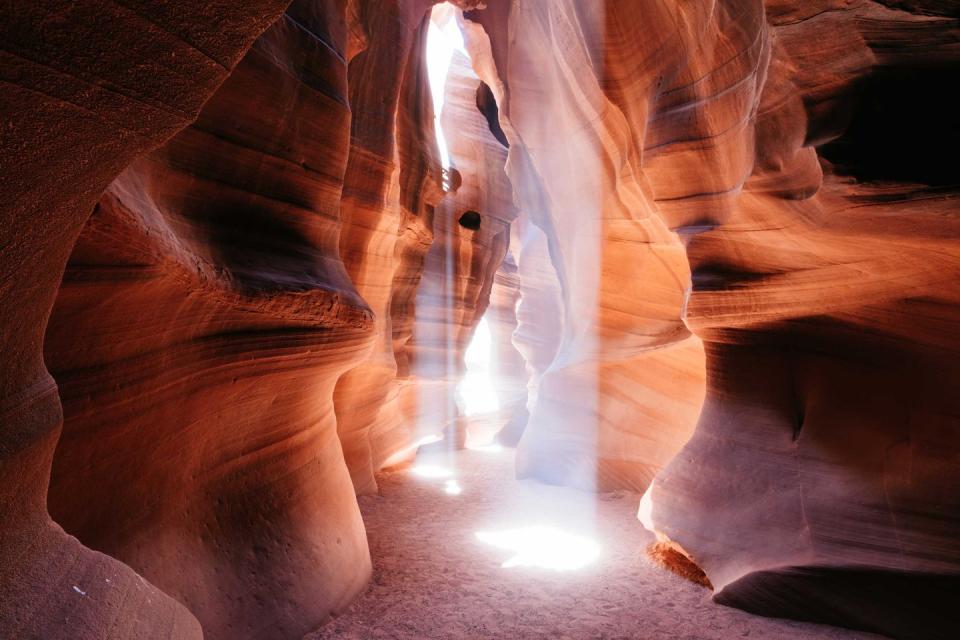 <p>The sun creeps in like a spotlight in majestic slot canyon Antelope Canyon in Page, Arizona. </p>