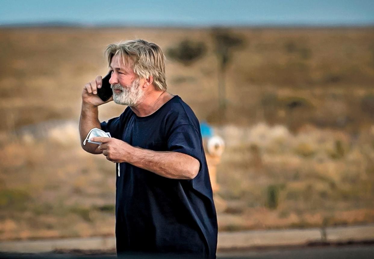 Alec Baldwin on the phone outside the Santa Fe County Sheriff's Office in New Mexico, after he was questioned about a shooting on the set of the film "Rust" on Oct. 21, 2021.