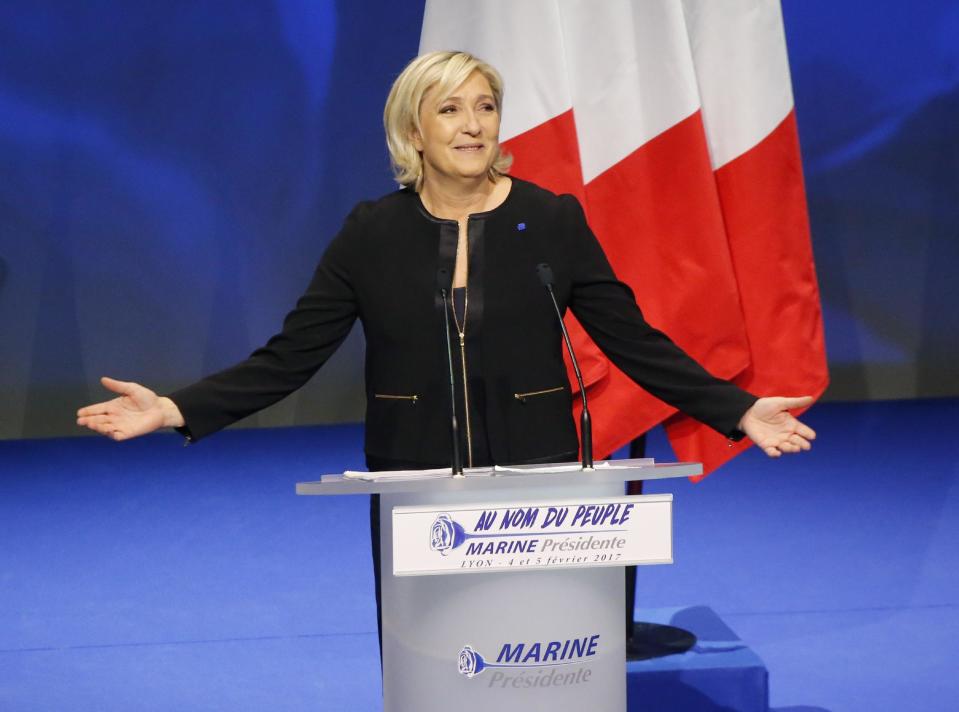 Far-right leader presidential candidate Marine Le Pen gestures as she speaks during a conference in Lyon, France, Sunday, Feb. 5, 2017. Marine Le Pen, the far-right presidential candidate, unveiled her platform Saturday at the start of a weekend conference, envisioning a thriving nation "made in France. (AP Photo/Michel Euler)