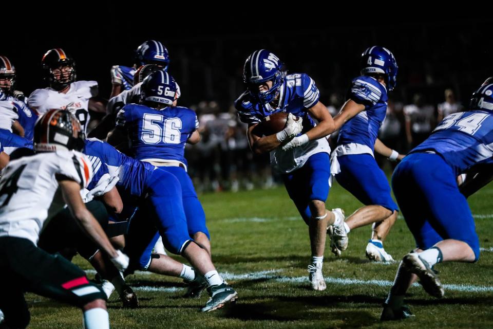 Van Meter running back Ben Gordon (26) carries the ball during a Class 1A first-round playoff game against Pleasantville on Friday. Van Meter won 49-0.