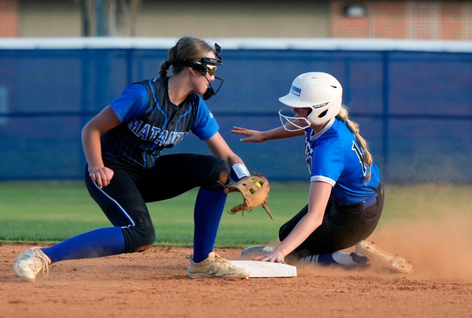 Matanzas Juliet Fogel attempts to put the tag on Deltona's Sophie Strempel during a District Championship game at Daytona State College in Daytona Beach, Thursday, May 2, 2024.