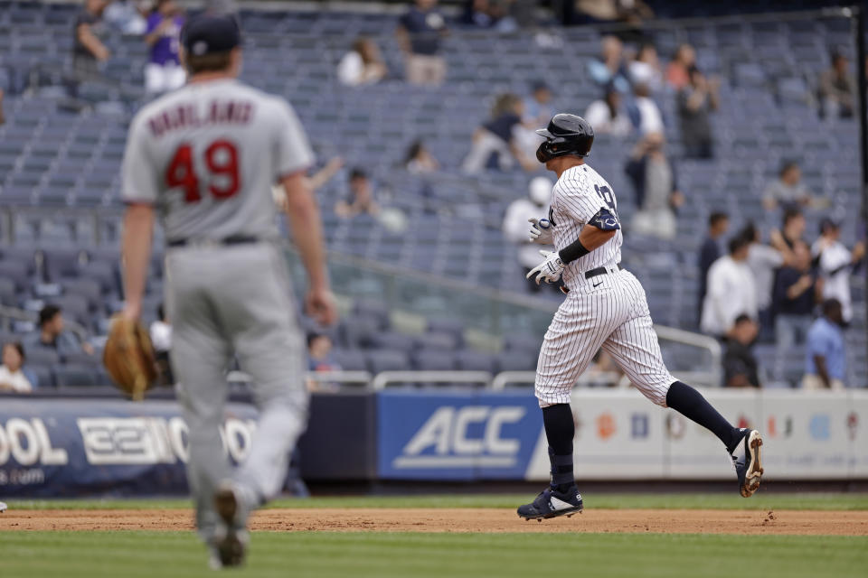New York Yankees' Aaron Judge rounds the bases after hitting a home run off of Minnesota Twins pitcher Louie Varland (49) during the fourth inning of the first baseball game of a doubleheader on Wednesday, Sept. 7, 2022, in New York. (AP Photo/Adam Hunger)