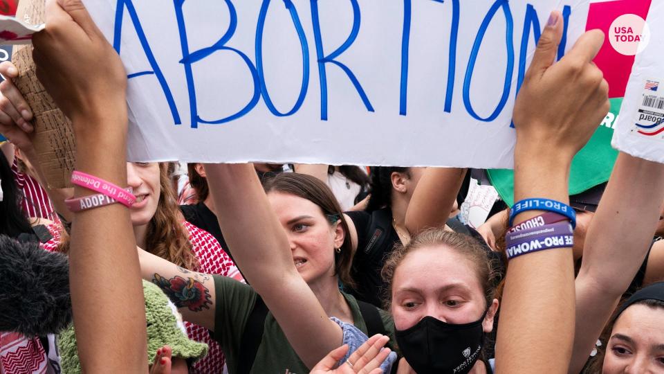 Abortion-rights demonstrators have a heated discussion with two anti-abortion protesters, Saturday, May 14, 2022, outside the Supreme Court in Washington. (AP Photo/Jacquelyn Martin)