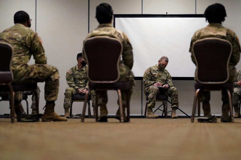 Sergeant Major of the Army Michael Grinston, second from right, gets feedback from soldiers about their concerns at Fort Hood, Texas, Thursday, Jan. 7, 2021. Following more than two dozen soldier deaths in 2020, including multiple homicides, the U.S. Army Base is facing an issue of distrust among soldiers. (AP Photo/Eric Gay)