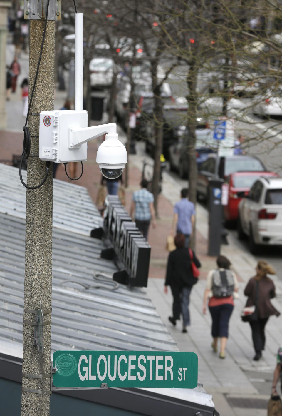 A surveillance camera is attached to a light pole along Boylston Street near the finish line of the Boston Marathon, Monday, April 14, 2014, in Boston. A year after twin pressure cooker bombs shattered the marathon and paralyzed the area for days, federal prosecutors say they have a trove of evidence ready to use against the surviving suspect, but many questions remain. (AP Photo/Steven Senne)