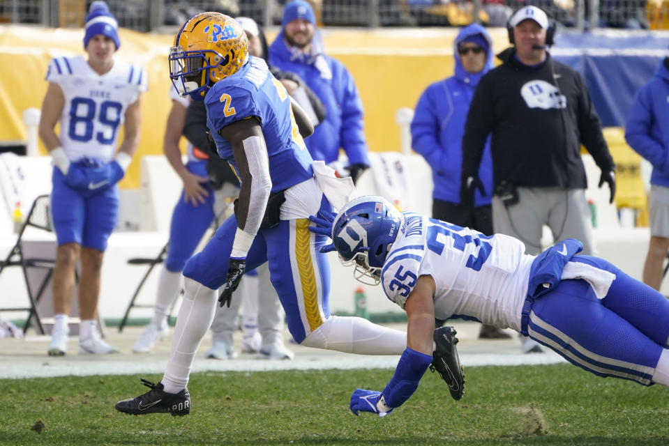 Pittsburgh running back Israel Abanikanda (2) runs away from Duke linebacker Cam Dillon (35) during the first half of an NCAA college football game, Saturday, Nov. 19, 2022, in Pittsburgh. (AP Photo/Keith Srakocic)