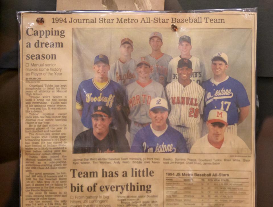 A Journal Star newspaper clipping from 1994 features the Journal Star Meto All-Star Baseball Team and Player of the Year Courtland Tubbs (20).