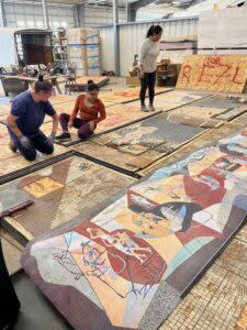  Restoration of the Pershing Mural that once spanned the facade of the Pershing Auditorium in Lincoln is time-consuming. (Courtesy of Pershing Mural Preservation Committee)