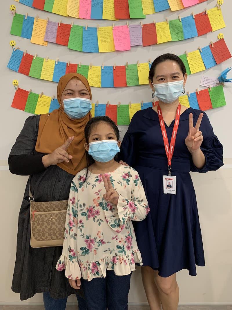 (from left) Mia's mother, Ramadiah Abd Rahman, Mia and Dr Fiona after a successful surgery leading to Mia’s improved eyesight. — Photo by Jasmin Zainal