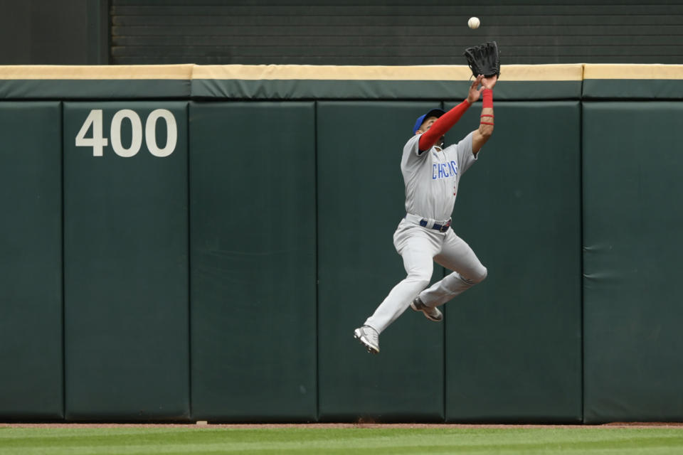 Chicago Cubs center fielder Christopher Morel catches a fly ball against the outfield wall hit by Chicago White Sox's Jake Burger during the eighth inning of a baseball game at Guaranteed Rate Field, Sunday, May 29, 2022, in Chicago. (AP Photo/Paul Beaty)