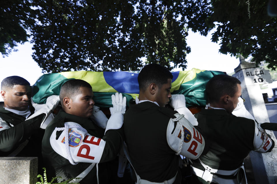 Members of the army police carry the coffin of former Brazilian soccer coach and player Mario Zagallo for his burial, at the São Joao Batista cemetery, in Rio de Janeiro, Brazil, Sunday, Jan. 7, 2024. Zagallo, who reached the World Cup final a record five times, winning four, as a player and then a coach with Brazil, died at the age of 92. (AP Photo/Bruna Prado)