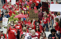 <p>Participants make their way towards the Legislative Building during a teachers rally at the General Assembly in Raleigh, N.C., Wednesday, May 16, 2018. (Photo: Gerry Broome/AP) </p>