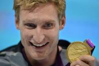 US swimmer Bradley Snyder poses with his gold medal after winning the men's 100m freestyle - S11 final swimming event at the London 2012 Paralympic Games at the Olympic Park's Aquatics Centre in east London on August 31