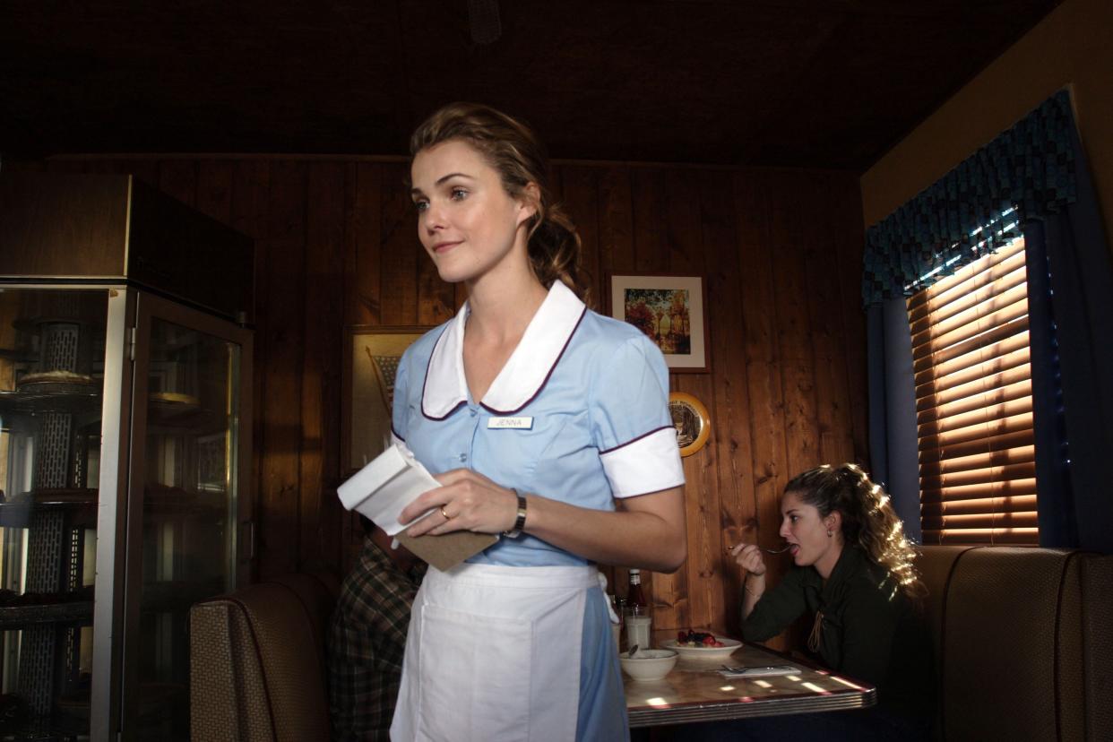 Keri Russell as Jenna in the film "Waitress." After becoming pregnant and stuck in an abusive marriage, Jenna decides to go through with the pregnancy, even though she says she "hates" it. At the end of the film, giving birth gives her the strength to leave her husband.