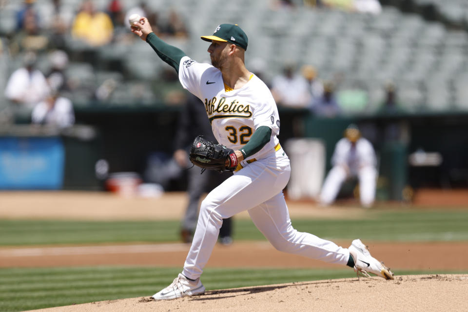 Oakland Athletics pitcher James Kaprielian (32) throws against the Atlanta Braves during the first inning of a baseball game in Oakland, Calif., Thursday, May 31, 2023. (AP Photo/Jed Jacobsohn)