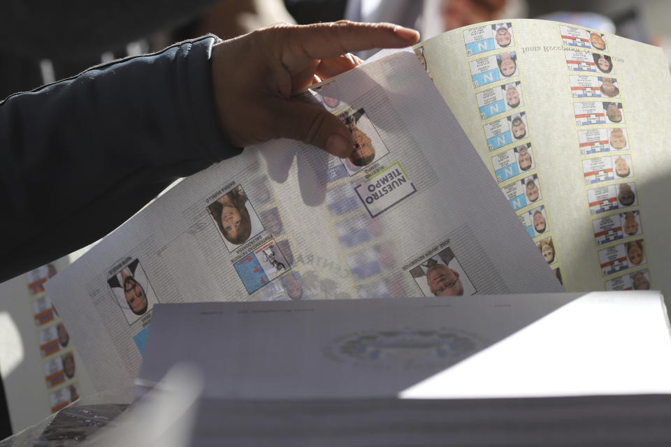 A voter casts the ballot during general elections in San Salvador, El Salvador, Sunday, Feb. 4, 2024. (AP Photo/Salvador Melendez)