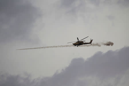 An Iraqi Air Force helicopter fires a missile against Islamic State militants during a battle in Mosul, Iraq March 28, 2017. REUTERS/Khalid al Mousily