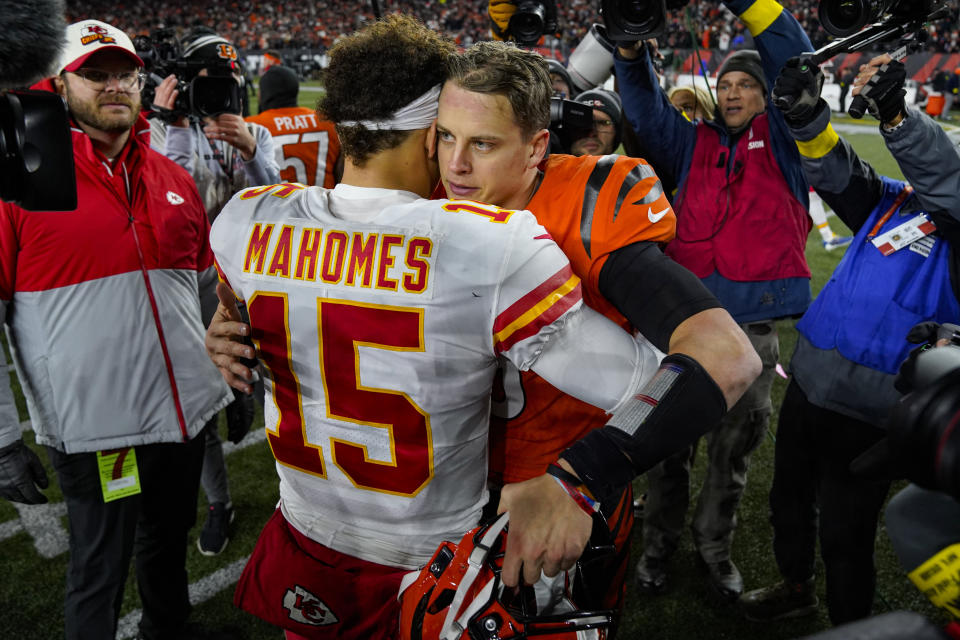 Cincinnati Bengals quarterback Joe Burrow (9) meets with Kansas City Chiefs quarterback Patrick Mahomes (15) following an NFL football game in Cincinnati, Fla., Sunday, Dec. 4, 2022. The Bengals defeated the Chief 27-24. (AP Photo/Jeff Dean)