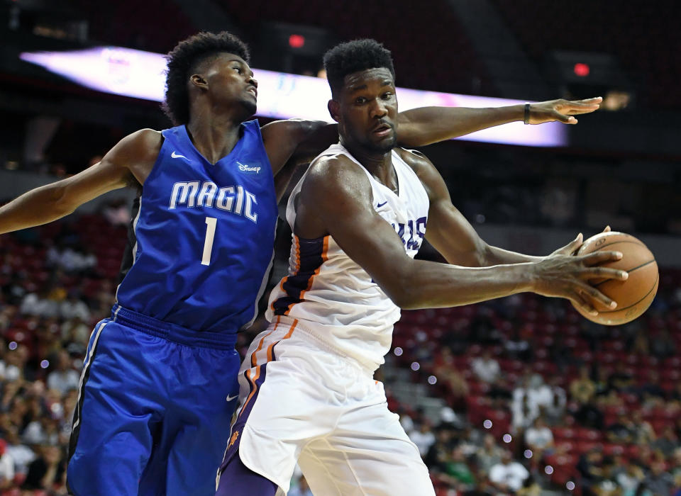 Deandre Ayton is guarded by the Magic’s Jonathan Isaac on Monday in Las Vegas. (Getty Images)