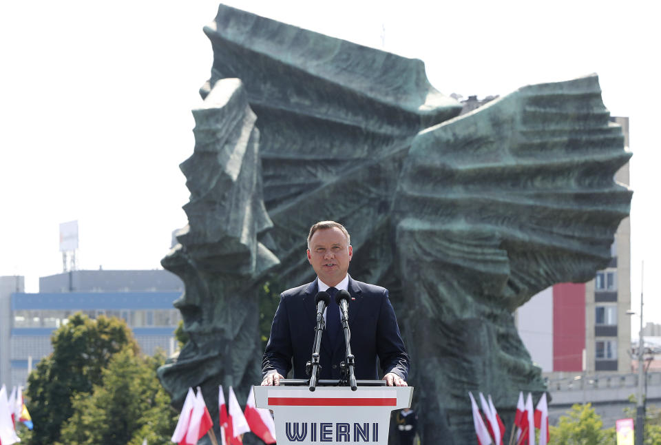 Poland's president Andrzej Duda, gives an address during the annual Armed Forces review during a national holiday, in Katowice, Poland, Thursday, Aug. 15, 2019. Large crowds turned out for the celebration which this year included a fly-over by two U.S. F-15 fighter jets. (AP Photo/Czarek Sokolowski)