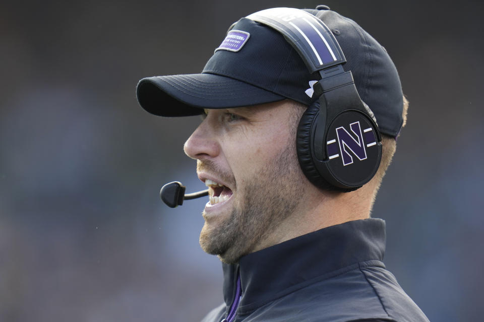 Northwestern interim head coach David Braun stands on the sideline during the first half of an NCAA college football game against Iowa, Saturday, Nov. 4, 2023, at Wrigley Field in Chicago. (AP Photo/Erin Hooley)