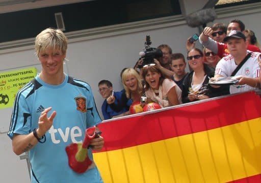 Spain's Fernando Torres waves to fans as he leaves a training session in Schruns. Sevilla striker Alvaro Negredo edged Roberto Soldado for the final striker's spot in defending champions Spain's squad for Euro 2012 that was announced by coach Vicent del Bosque