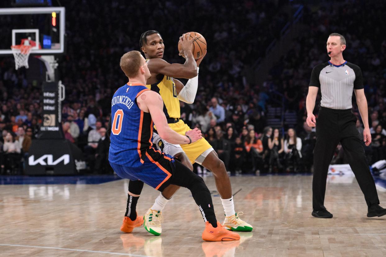 Feb 10, 2024; New York, New York, USA; Indiana Pacers guard Bennedict Mathurin (00) looks to pass the ball as New York Knicks guard Donte DiVincenzo (0) defends during the first quarter at Madison Square Garden. Mandatory Credit: John Jones-USA TODAY Sports