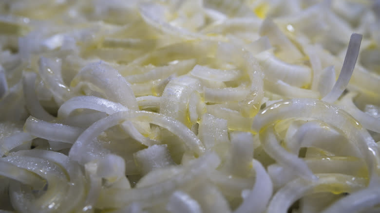 chopped white onions in pan