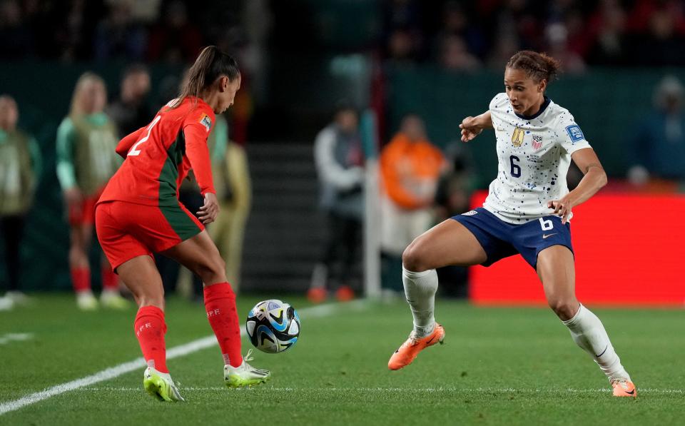 USA forward Lynn Williams pressures Portugal defender Catarina Amado during the second half a group stage match.