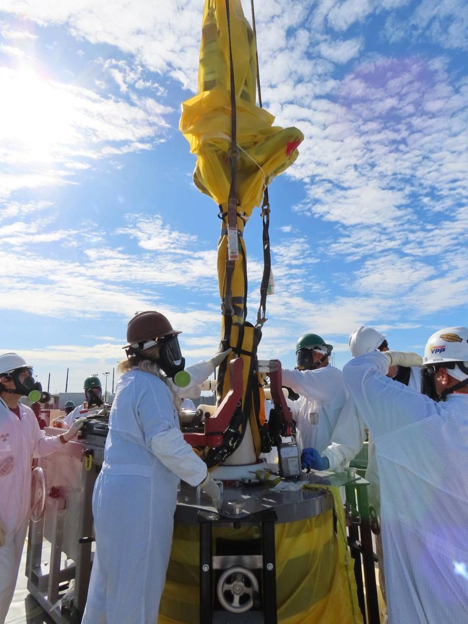 Hanford site workers remove a pump from a double-shell underground radioactive waste tank that will be used to stage waste until it can be pretreated and sent to the vitrification plant to be glassified.