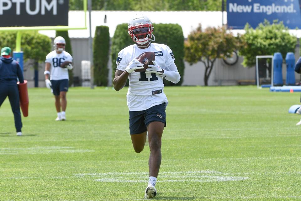 May 23, 2022; Foxborough, MA, USA; New England Patriots wide receiver DeVante Parker (11) catches the ball at the team's OTA at Gillette Stadium. Mandatory Credit: Eric Canha-USA TODAY Sports