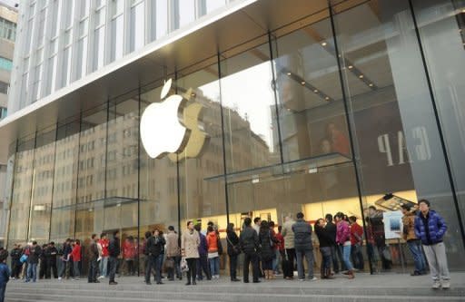 Customers wait for an Apple store to open in Shanghai on December 7, 2012. Apple is to face "strengthened supervision" from China's consumer watchdog, state media reported Friday, as the US computer giant faces a barrage of negative publicity in China