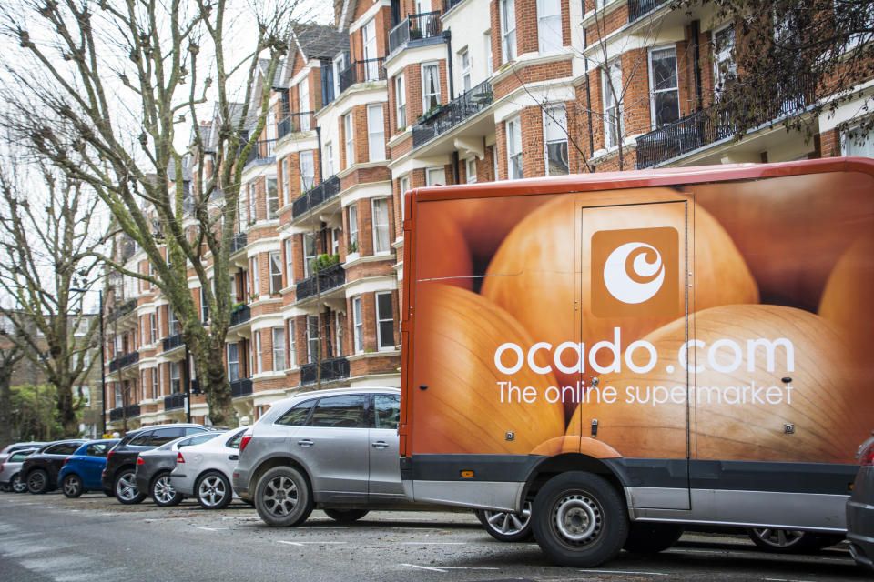 An Ocado delivery vehicle on delivery in a residential setting in north west London- a large British online supermarket